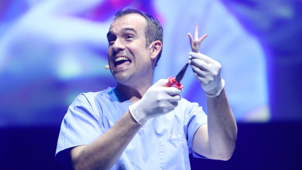 Celebrity medic Dr Chris scrubs up alright. 