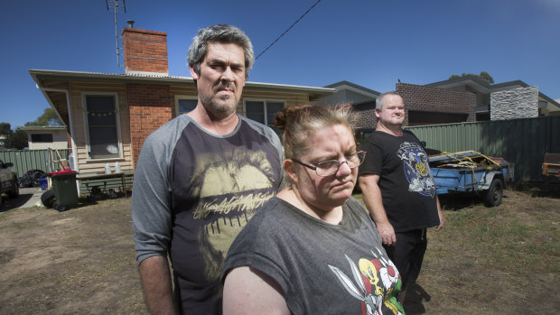 Ronald Lyons, Christine Lyons and Peter Arthur outside their home in Kangaroo Flat.