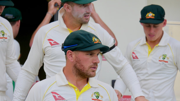 Capped: Aaron Finch sports his new baggy green for Australia on the first day of the first Test against Pakistan in Dubai.