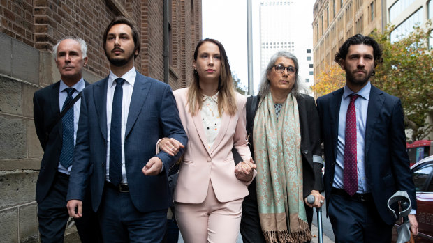 Hannah Quinn (centre) arrives at the NSW Supreme Court on Friday to be sentenced.