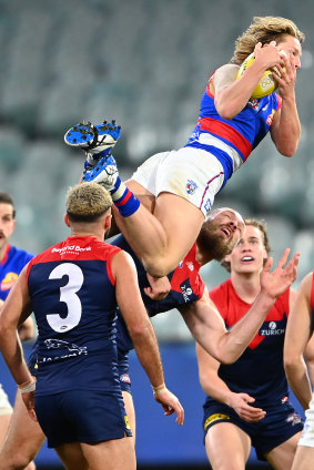 Cody Weightman soars over Max Gawn.