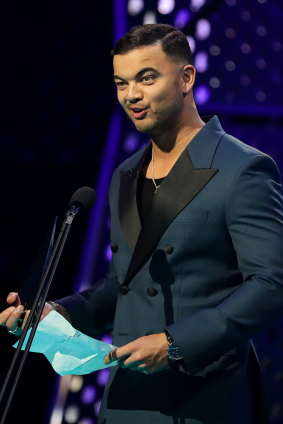 Guy Sebastian accepts his surprise song-of the year award. 