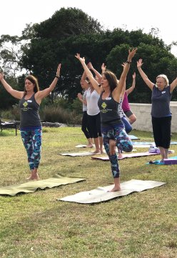 Adele Rancan (right), leading a fitness class with twin sister Lisa (left).