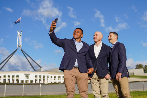 Allan Alaalatoa, David Pocock and Nic White take a selfie out the front of Parliament House in Canberra on Thursday morning. 