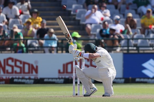 Australia’s Josh Inglis ducks under a bouncer on day two.