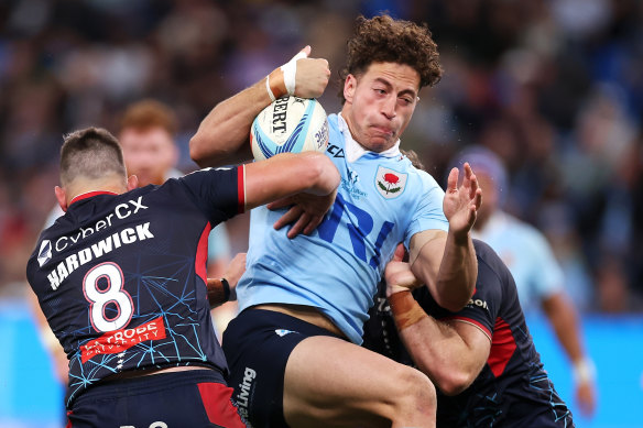 Mark Nawaqanitawase carries for the Waratahs.