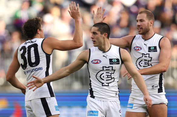 Carlton celebrate a goal against Fremantle.