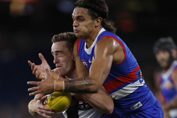 Ben Paton of the Saints competes with Jamarra Ugle-Hagan of the Bulldogs during the round two.