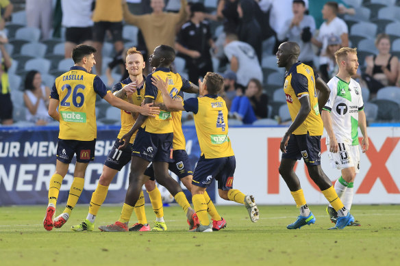 Alou Kuol celebrates a goal for the Mariners in February.