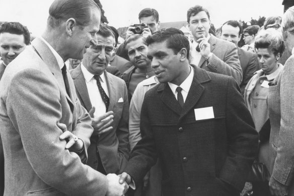 Prince Phillip meets Australian boxing champion Lionel Rose in 1968.