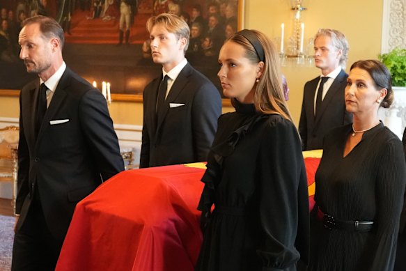 Marius Borg Høiby, back right, was also allowed to attend the transfer of King Harald’s coffin through the royal palace to the palace chapel on Monday.