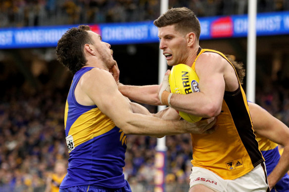 Luke-off: Luke Bruest of the Hawks fends off Luke Shuey of the Eagles.