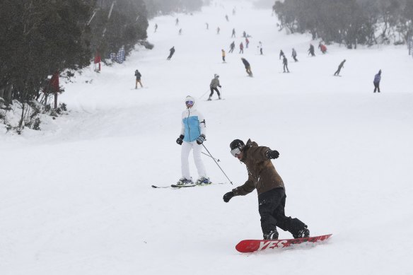 The slopes are busy on the opening day of the ski season at Thredbo.