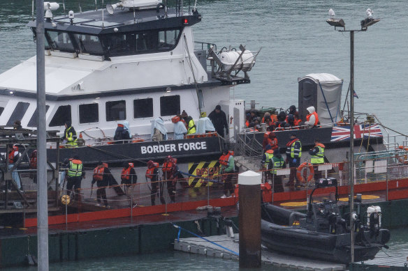 Migrants are brought ashore after being picked up in the English Channel by a Border Force vessel last week.