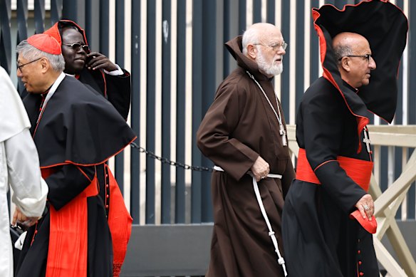 Cardinals leave a meeting in Rome on Monday. 