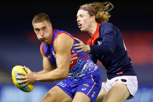 Melbourne’s Jayden Hunt tackles Bulldog Roarke Smith last season. 