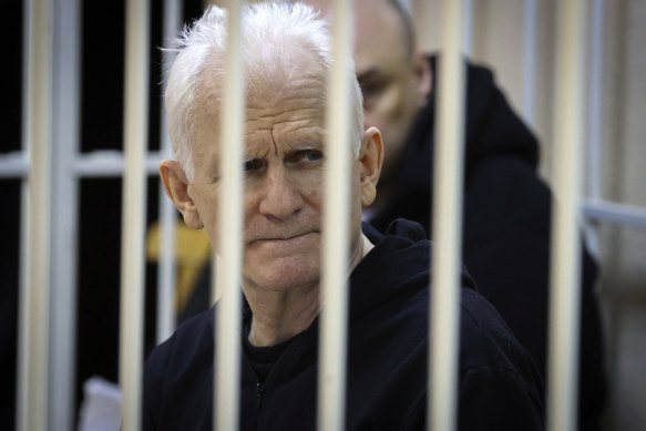 Ales Bialiatski, the head of Belarusian Vyasna rights group, sits in a defendants’ cage during a court session in January.