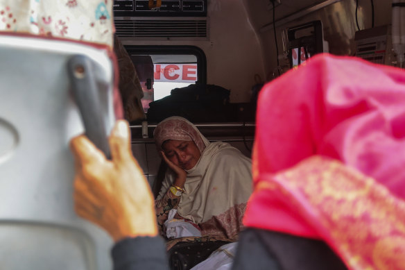 Relatives of stampede victim mourn in an ambulance outside a morgue in Allahabad, India.