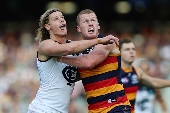 Reilly O’Brien (right) made life hard for in-demand ruckman Tom De Koning in round eight.