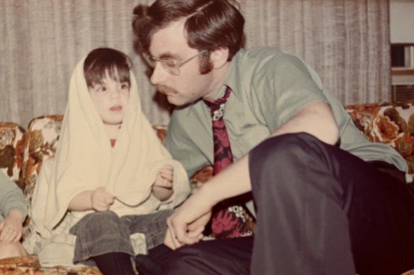 The author as a child in Canada in 1976 with her father, David.