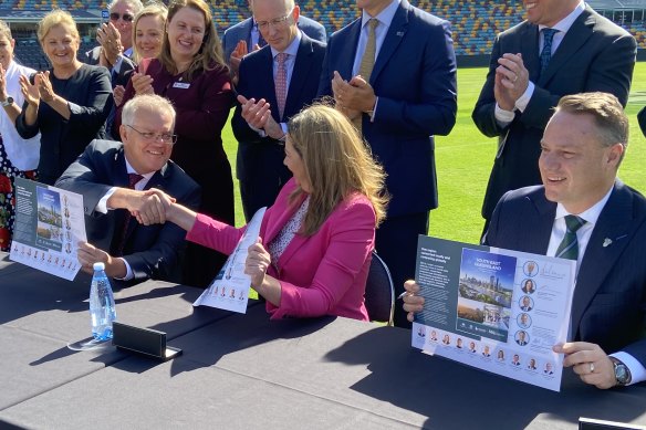 Prime Minister Scott Morrison, Queensland Premier Annastacia Palaszczuk and Brisbane lord mayor Adrian Schrinner signing the SEQ City Deal at the Gabba.