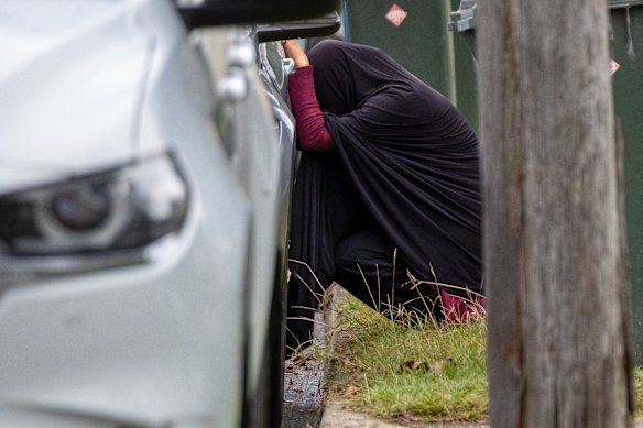 A group close to the family broke down in grief after arriving at the crime scene.