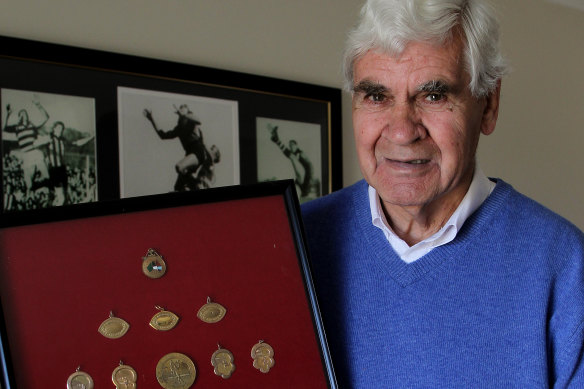AFL great Graham 'Polly' Farmer at home in 2010 with his medals. 