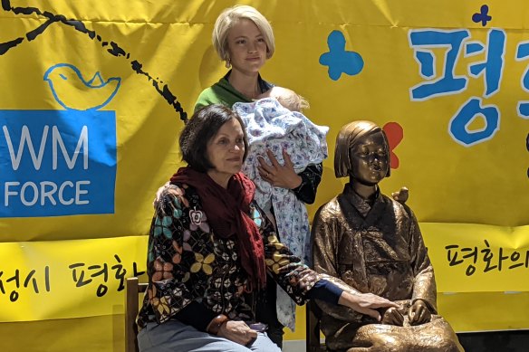 Ruby (standing) and Carol Challenger, granddaughter and daughter of Jan Ruff O'Herne, with the statue in Oakleigh. O'Herne was a Dutch-Australian woman forced into sex slavery by the Japanese military during World War II. Ruby Challenger has received funding from Korean groups to make a film about her grandmother's experiences.