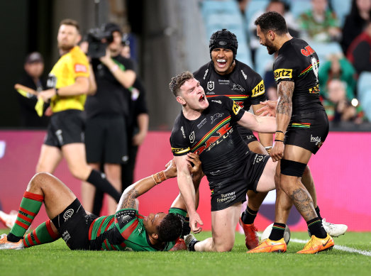 Penrith celebrate Liam Martin’s match-winning try.