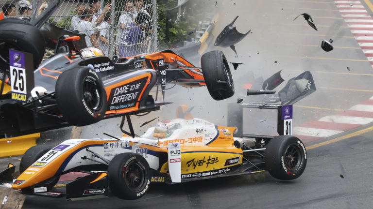 Sophia Floersch goes over Japanese driver Sho Tsuboi's car while flying off the track at high speed on a tight right-hand bend on lap four.