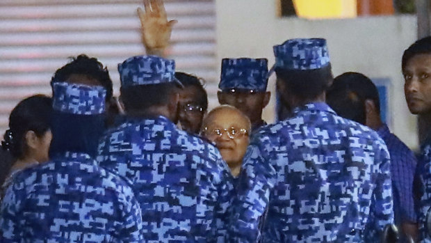 Policemen arrest former Maldives president and opposition leader Maumoon Abdul Gayoom early on Tuesday.