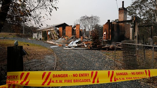 A home destroyed by bushfire in Koorainghat, south of Taree in NSW, Monday, November 11, 2019. Parts of NSW face catastrophic bushfire danger on Tuesday, with residents in bushland areas told to leave early rather than wait for fresh fires to start. (AAP Image/Darren Pateman) NO ARCHIVING