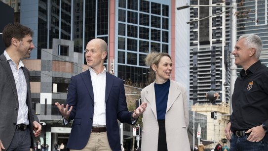 After years of animosity, executives from Uber and officials from the TWU put on a display of bonhomie in Sydney on Tuesday. From left, union assistant secretary Nick McIntosh, Uber Australia boss Dom Taylor, Uber Eats’ local head Becy Nyst, and union national secretary Michael Kaine.