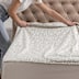 The correct way to put top sheets on the bed is right side down so when you fold them back the print is showing.
