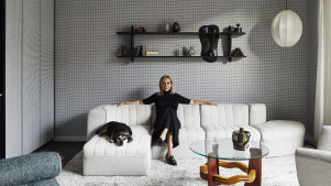 Tanya Hansen with her dog, Rosie, in the formal lounge. “I sit here at night and think, ‘How I love this place,’ ” she says. “Simone and Cindy have created a home that I adore.”