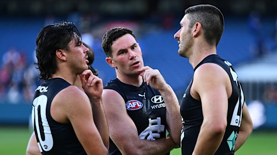 Time to ponder: The Blues looked dejected after their defeat.