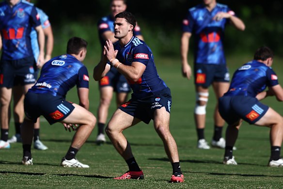 Nathan Cleary warming up before NSW trained at Somerset College on the Gold Coast on Saturday.