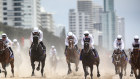  Jockeys ride horses on Surfers Paradise Beach, prior to the 2020 Magic Millions official draw at Surfers Paradise Foreshore in 2020.