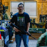 Tony Lu, 35, gives talks to school students at Taiwan Airsoft and Airgun Association about his experience fighting in Ukraine in 2022. He is wearing a T-shirt with the portrait of his friend, Australian Trevor Kjeldal, who died in battle in Ukraine.