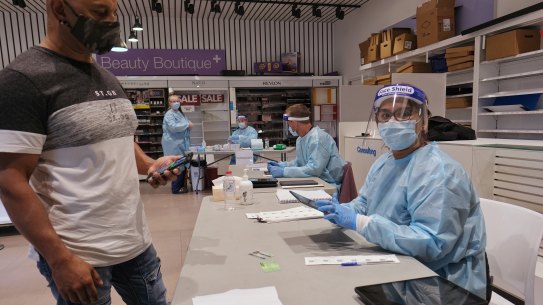 People get tested for COVID-19 at the DHHS testing facility at Melbourne Airport on Sunday.