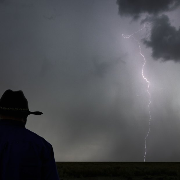 Gayini land manager Jamie Woods watches as a storm rolls in over the wetlands.