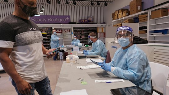 People get tested for COVID-19 at the DHHS testing facility at Melbourne Airport on Sunday.