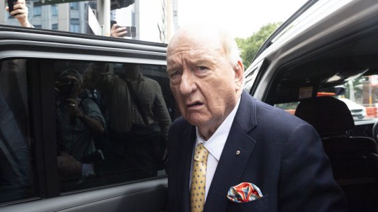 Alan Jones arrives at court in his white BMW.