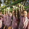 Students at Queenwood play on the monkeybars after their parents struck a deal with the school not to buy students a smartphone.