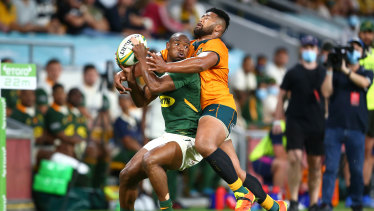 South Africaâs Makazole Mapimpi is tackled by Folau Faingaâa. 