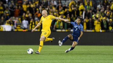 Australia's Aaron Mooy in action against Abishek Rijal.