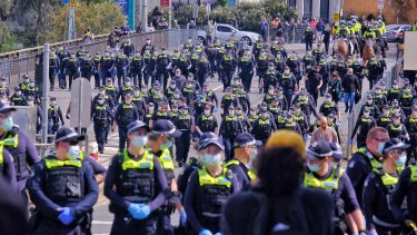 Police in Melbourne during an anti-lockdown protest on Saturday.