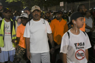 Port Moresby Governor Powes Parkop (centre) on his predawn walk with citizens.