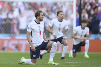England players take the knee ahead of the Euro 2020 semi-final against Denmark.
