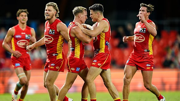 Ben Ainsworth, right, celebrates a goal with Suns teammate Darcy MacPherson. 
